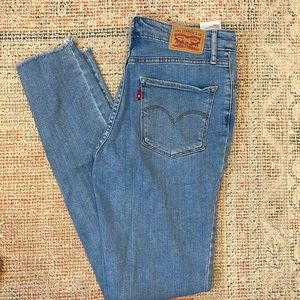 Levi’s 721 Skinny light wash distressed jeans